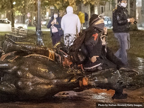 statue toppled over